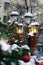 Street lamp decorated with christmas staff pine cones, red berries, fir bunch