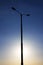 Street lamp on a lamppost against in the sunset light.