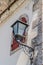 Street lamp and a window with iron shutters in the Old Bazaar Kujundziluk, the muslim quarter of the old town of Mostar