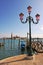 Street lamppost and Grand Canal in Venice.