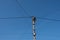 Street lamppost with wires. Concrete pole with a lantern. Street lamp without lamp.