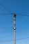 Street lamppost with wires. Electric wires against the blue sky.