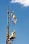 street lamps with elephant sculpture against bluet sky