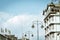 Street light against city buildings and blue sky background. Mini sensor solar lamp street light with blue clear sky