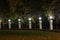 Street light.Decorative fence with glowing balls in the city Park.