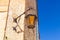 Street light mounted on a wall in Mdina, Malta