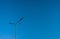 The street light pole with a blue sky background - Automatic street twin lamp against the blue sky with copy space