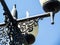 Street light post with four lamps and blue sky