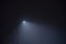 Street light`s beam in foggy night. Dense fog