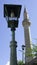 Street lighting in the form of old-fashioned lantern by day and Nezir Agina Mosque in Old town of Mostar, Bosnia and Herzegovina