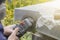 Street lighting. a masked worker processes a granite stone with a special tool. Close-up