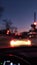 Street Lights and colorful traffic lights from the car. Night Blur Bokeh Abstract. Urban atmospheric mood. Vertical