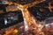 The street is lit by street lamps in the city of Wroclaw. Night panorama of the city from a height