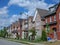 Street with long row of modern brick townhouses