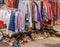 Street market racks of pre-loved clothes for sale