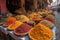 street market with a variety of spices and herbs, including saffron, turmeric, and cinnamon