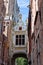Street medieval passage above the street in Bruges / Brugge, Belgium