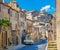 A street in the medieval town of Bomarzo, a castle over the city on a hill.