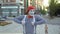 Street mime in red beret show thumbs up to camera