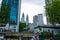 Street of the modern city of Kuala Lumpur. View of the tops of the skyscrapers of the famous twin towers of Petronas
