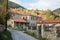 Street in the mountainous Kratero village in Florina, Greece, with old stone houses and Autumn colours