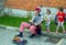 Street musician, playing accordion, entertaining children