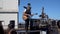 Street musician playing various instruments himself, making a performance, USA