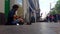 Street musician plays an ethnic instrument on a busy street