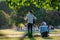 Street musician plays the guitar in the park. summer green park, rock musician gives a free concert in the park