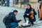 Street musician talks with tourist, Prague Castle, Czech Republic