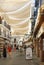 Street in nerja, spain. shoppers shopping and