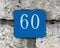 Street Number 60 on a Stone Wall