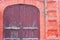 Street with old brick houses. 100 year old house with beautiful old wooden gates. on a snowy winter day