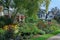 Street with old houses with gables and colorful flower bed