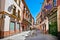 Street in old part of Seville town on summer day, Spain.