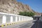 The street into Old Town Muscat, Oman with gates and tunnel in and through the mountains.