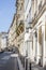 Street of the old town with stone storey houses with balconies