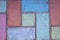 Street paving stones painted with chalk. Asphalt chalk drawing. Street tile decorated with crayons, view from above