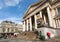 Street with people, buildings, museums and Bourse de Bruxelles of historical city