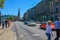 Street with people and cars near metro station Alsterhaus and lake Alster Binnenalster Hamburg, Germany.