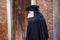 A street performer with Bauta mask in Venice, Italy