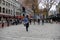 Street performer drawing a crowd that watches him leap over a tourist from the crowd,Faneuil Hall,Boston,Mass,2014