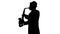 Street Performer Energetically Playing Saxophone Silhouette