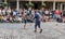 Street performer engages audience outside Covent Garden