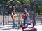 Street performers playing acoustic music with guitars in Greenwich. 