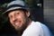 Street portrait of a smiling man in a stylish hat