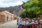 Street of Purmamarca town with traditional handicraft clothing stalls - Purmamarca, Jujuy, Argentina