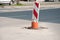 Street reconstruction or construction barricade caution red and white sign cover the open hole of manhole on the road as a precaut