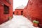 Street with red-walled houses Saint Catalina, Arequipa, Peru