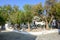 Street restaurant in the shade of trees in beautiful Chora on Folegandros Island.